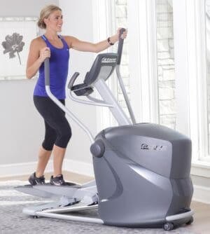 Octane Q35x Elliptical with model walking on it.