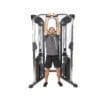 Bodycraft HFT Pro Functional Training Gym with model doing standing incline chest press (extended).