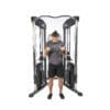 Bodycraft HFT Pro Functional Training Gym with model doing bicep curls.