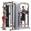 Hoist MI-7 Smith and Functional Training System Ensemble with male model doing bicep curls and female model doing triceps push downs.
