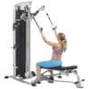 Hoist MI-5 Functional Training Gym with model doing seated bicep curls.