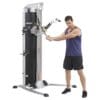 Hoist MI-5 Functional Training Gym with model doing golf swing exercise.