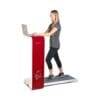 Bodycraft Spacewalker Workstation Treadmill with model walking and using a laptop.