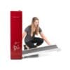 Bodycraft Spacewalker Workstation Treadmill with model unlocking the belt from the floor position and folding it up.