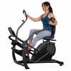 Teeter Freestep LT3 Recumbent Crosstrainer with Model and handles pointed up.