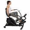 Teeter Freestep LT3 Recumbent Crosstrainer with Model and handles pointed down.