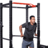 Inspire FCG1/FPC1 Full Cage Power Cage with Model doing dips on dip bars.