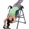 Teeter Hang Ups FitSpine X1 Inversion Table with Model inverted.