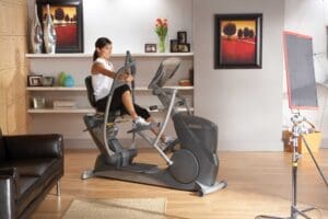 Octane XR6 Classic Seated Elliptical with Model doing seated elliptical workout.