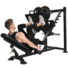 Powertec Leg Press with weight plates and Model compressing legs.