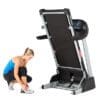 3G Cardio Pro Runner Treadmill folded up with Model tying shoes.