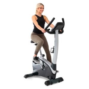 3g Cardio Elite UB Upright bike front right with model pedaling.