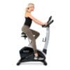 3g Cardio Elite UB Upright bike right side with model pedaling.