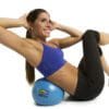 GoFit Core Ab Ball under model doing knee to elbow crunches.