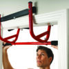 GoFit Elevated Chin Up Station back side with model doing wide pull ups on bottom handles.