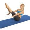 GoFit Pilates Mat with model doing full boat yoga pose.