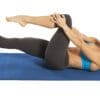 GoFit Pilates Mat with model doing single knee to chest yoga pose.