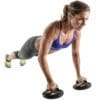 GoFit Pivoting Push-Up Pods with model extending arms facing right.