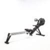 A sleek rowing machine with a digital display, designed for full-body workouts that target strength and cardio.