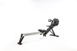 A sleek rowing machine with a digital display, designed for full-body workouts that target strength and cardio.