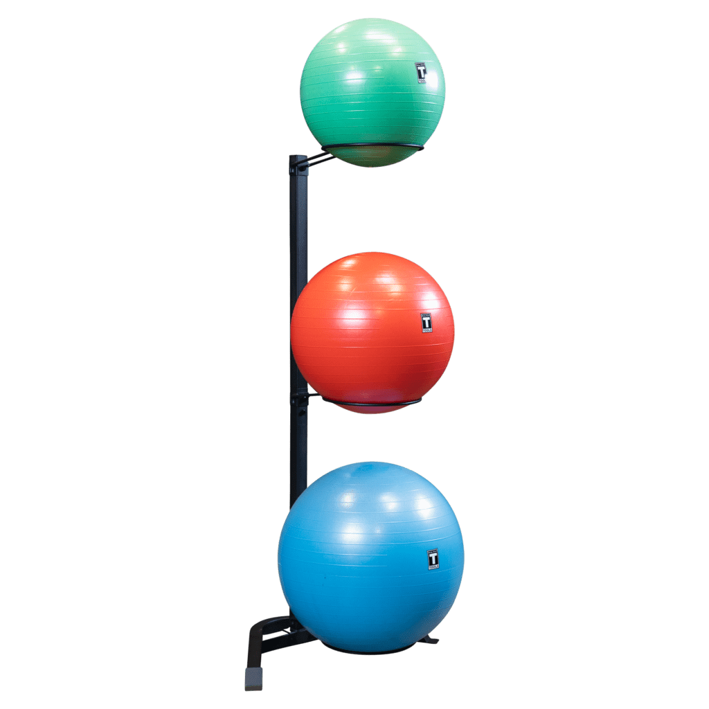 A vertical rack holds three stability balls in green, red, and blue, keeping them organized and accessible for workouts.