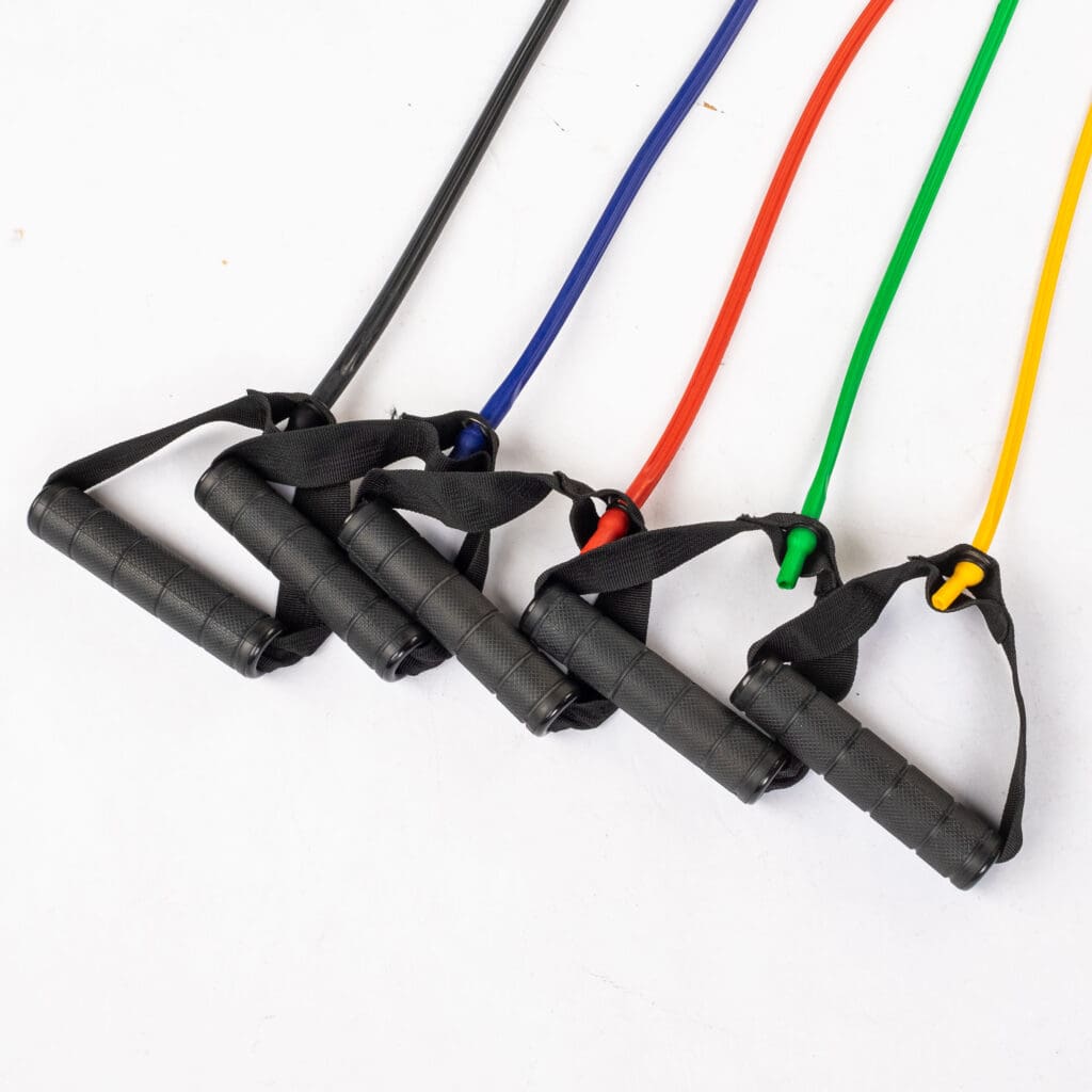 Resistance bands in black, blue, red, green, and yellow with black handles for strength training and flexibility exercises.